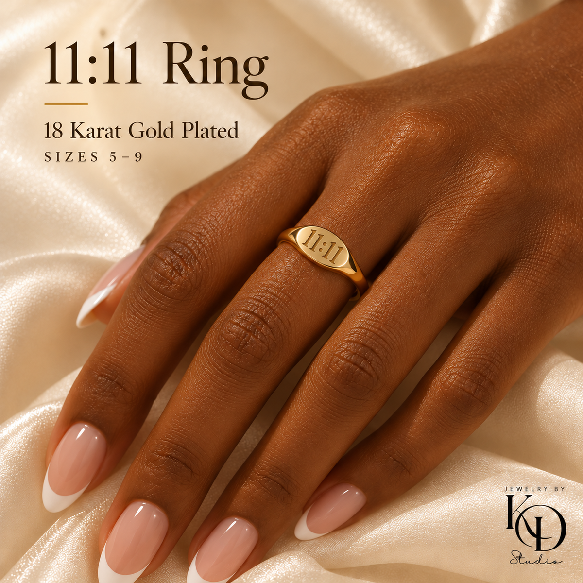 11:11 gold ring on French manicured hand with upright engraving