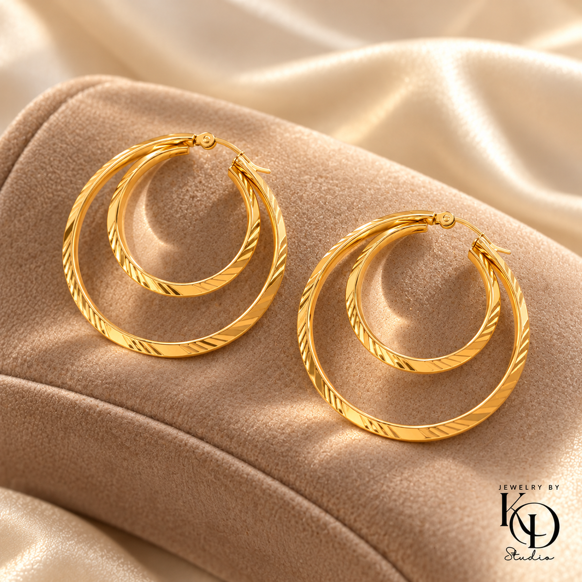Double Take Hoop Earrings on a taupe velvet cushion — Jewelry by KD Studio